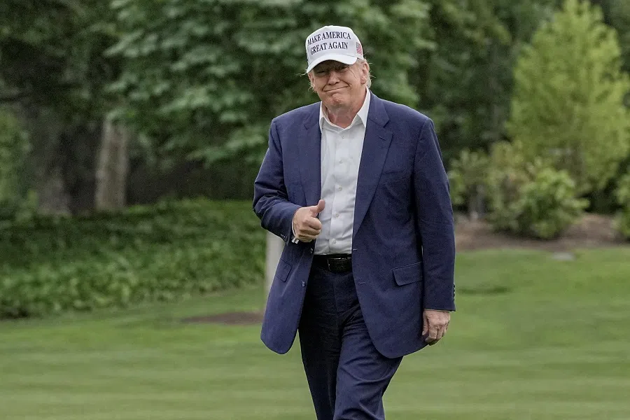 US President Donald Trump gives a thumbs up as he walks on the South Lawn of the White House in Washington, DC, US, on 25 May 2025. (Ken Cedeno/Reuters)