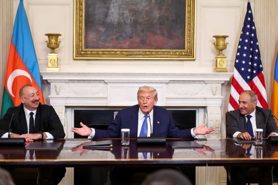 US President Donald Trump gestures during a trilateral signing event with Armenia’s Prime Minister Nikol Pashinyan and Azerbaijan’s President Ilham Aliyev, at the White House, in Washington, DC, on 8 August 2025. (Kevin Lamarque/Reuters)