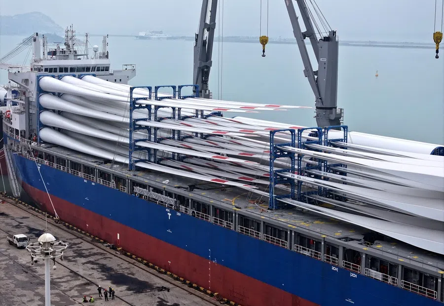 A ship loaded with wind turbine parts is seen at Lianyungang port, in Jiangsu province, China, on 13 September 2025. (AFP)
