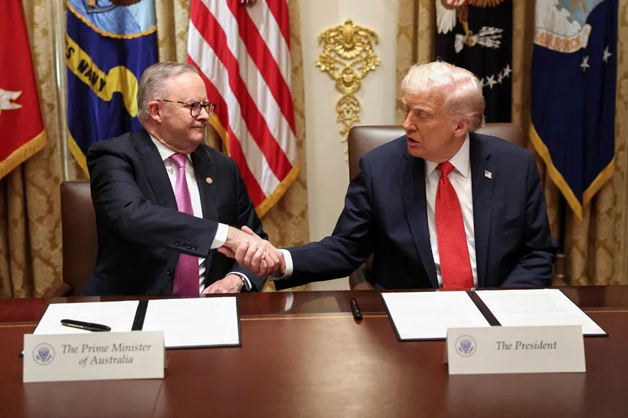 US President Donald Trump and Australia’s Prime Minister Anthony Albanese shake hands as they sign an agreement on rare earth and critical minerals during a meeting in the Cabinet Room at the White House, in Washington, DC, US, on 20 October 2025. (Kevin Lamarque/Reuters)