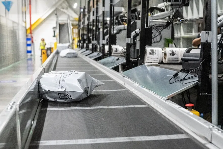 Packages on a conveyor belt at an Amazon same-day delivery fulfillment centre on Prime Day in the Bronx borough of New York, US, on 16 July 2024. (Stephanie Keith/Bloomberg)