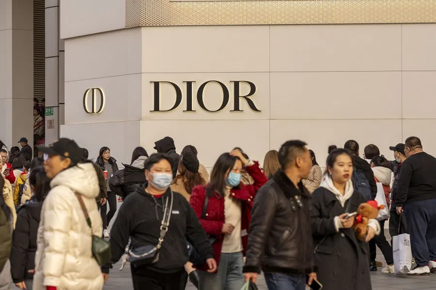 Shoppers pass a Christian Dior store on East Nanjing Road in Shanghai, China, on 11 February 2024. (Raul Ariano/Bloomberg)