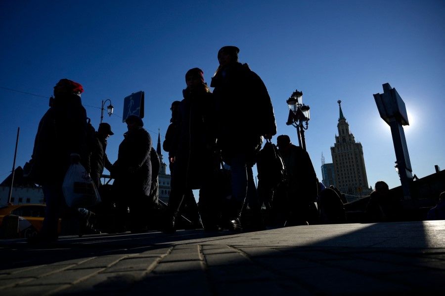People walk on Komsomolskaya Square in Moscow on 17 March 2023. (Natalia Kolesnikova/AFP)