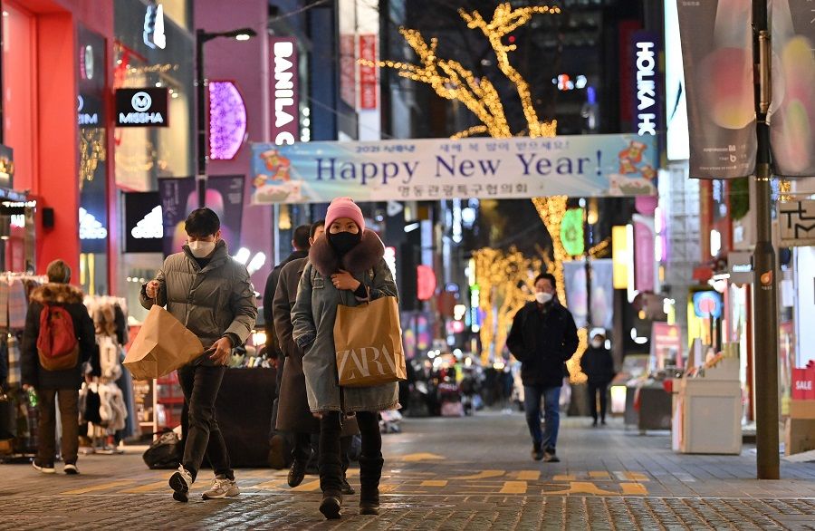 People visit a shopping district on New Year's Eve in Seoul on 31 December 2020. (Jung Yeon-je/AFP)