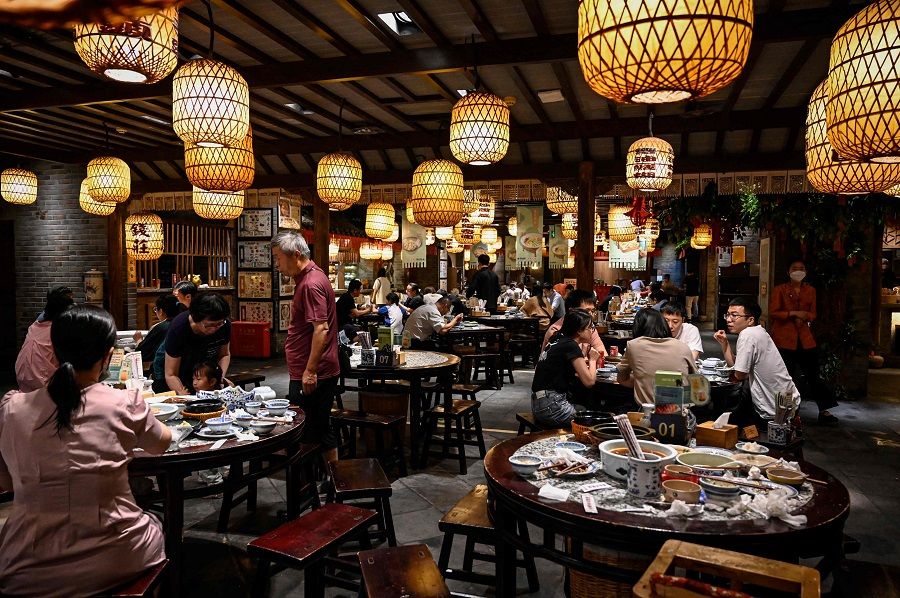 People dine at a restaurant in Beijing, China, on 6 June 2022. (Jade Gao/AFP)