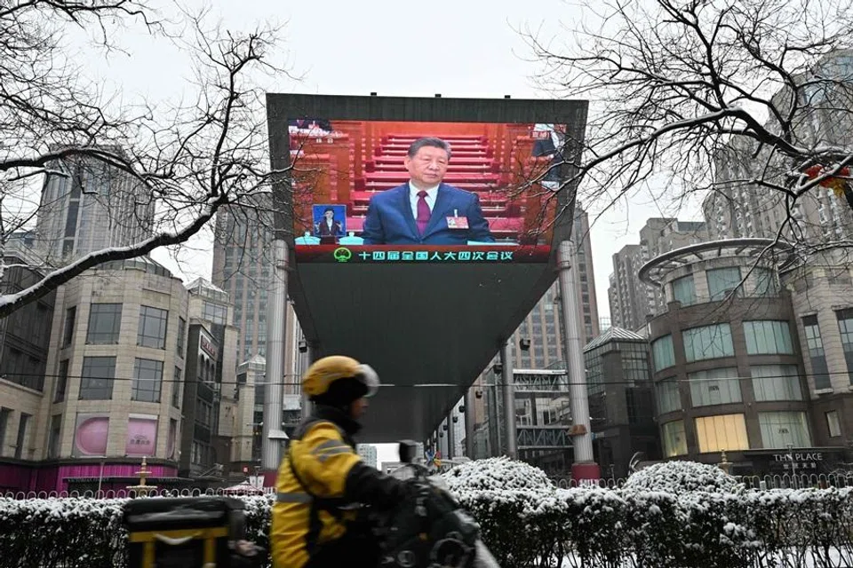A screen shows Chinese President Xi Jinping during the opening session of the National People’s Congress at the Great Hall of the People, in Beijing on 5 March 2026. (Adek Berry/AFP)