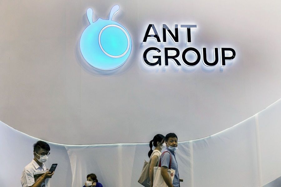 Attendees walk past the Ant Group Co. logo at the World Artificial Intelligence Conference (WAIC) in Shanghai, China, on 8 July 2021. (Qilai Shen/Bloomberg)