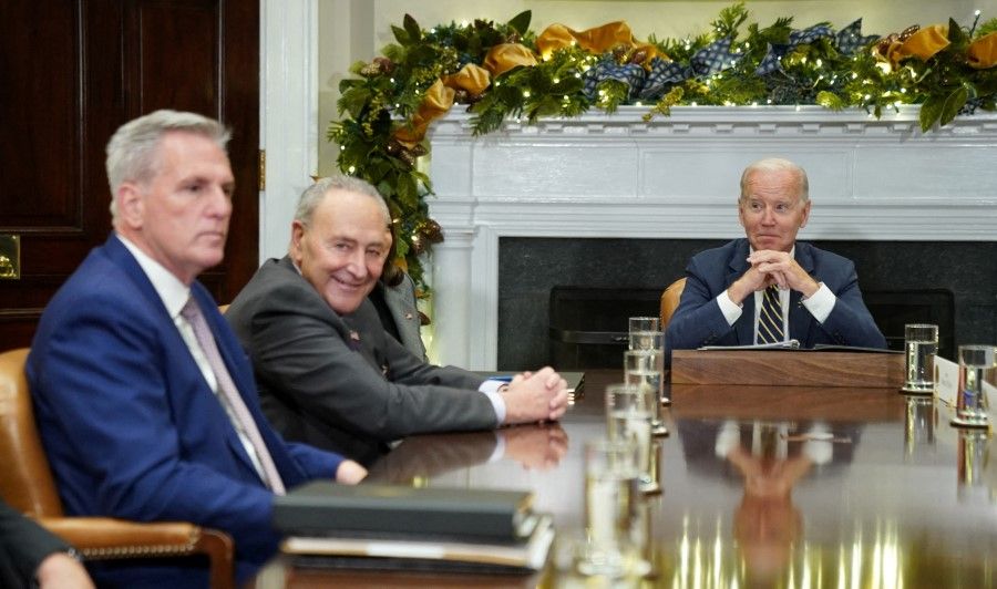 US President Joe Biden looks toward House Republican leader Kevin McCarthy and Senate Majority Leader Chuck Schumer, during a meeting with congressional leaders at the White House in Washington, US, 29 November 2022. (Kevin Lamarque/Reuters)