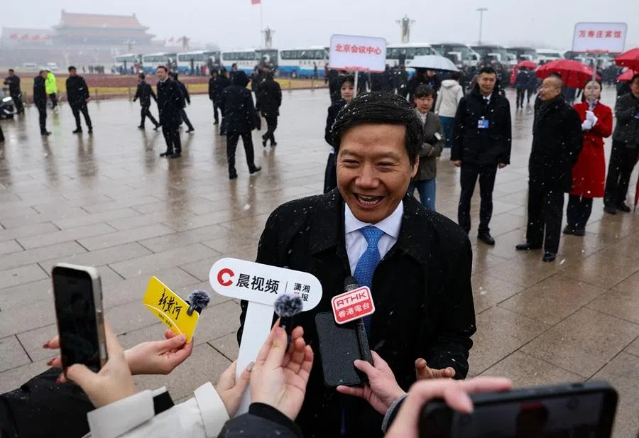 Xiaomi founder and CEO Lei Jun speaks to the media amid snowfall on Tiananmen Square in Beijing, China, on 4 March 2026. (Tingshu Wang/Reuters)