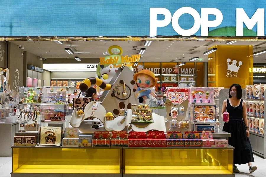 A woman visits a Pop Mart shop at a mall in Beijing on 12 June 2025. (Adek Berry/AFP)