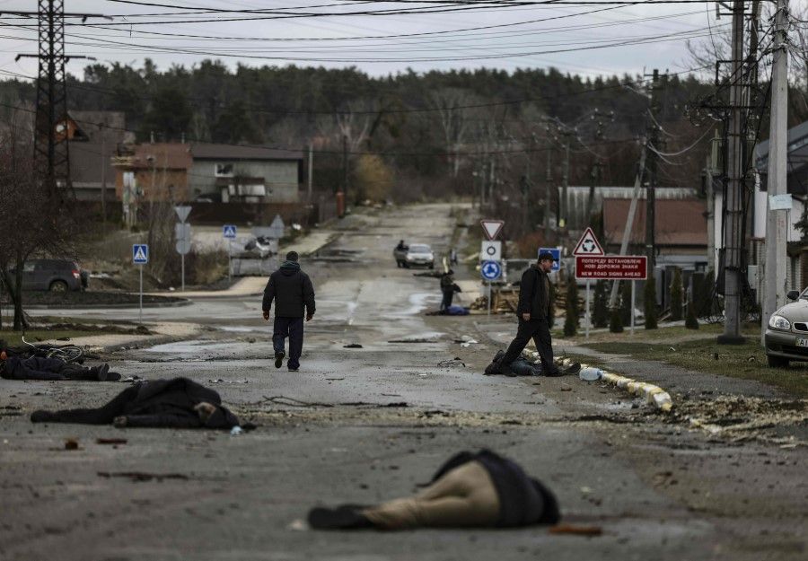 Bodies lie on a street in Bucha, northwest of Kyiv, as Ukraine says Russian forces are making a "rapid retreat" from northern areas around Kyiv and the city of Chernigiv, on 2 April 2022. (Ronaldo Schemidt/AFP)