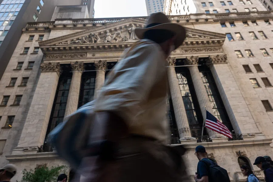 People walk by the New York Stock Exchange on 12 August 2025 in New York City, US. (Spencer Platt/Getty Images/AFP)