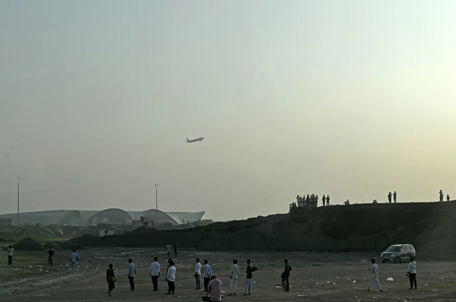 An aircraft above the Navi Mumbai International Airport in Mumbai, India, 8 October 2025. (Indranil Aditya/Bloomberg)