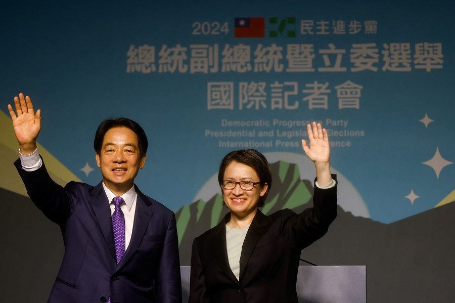 Taiwan President-elect Lai Ching-te of the Democratic Progressive Party (DPP) and his running mate Hsiao Bi-khim wave as they hold a press conference, following the victory in the presidential elections, in Taipei, Taiwan, on 13 January 2024. (Ann Wang/Reuters)