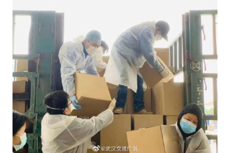 Unloading and sorting parcels before delivering to residents' homes.