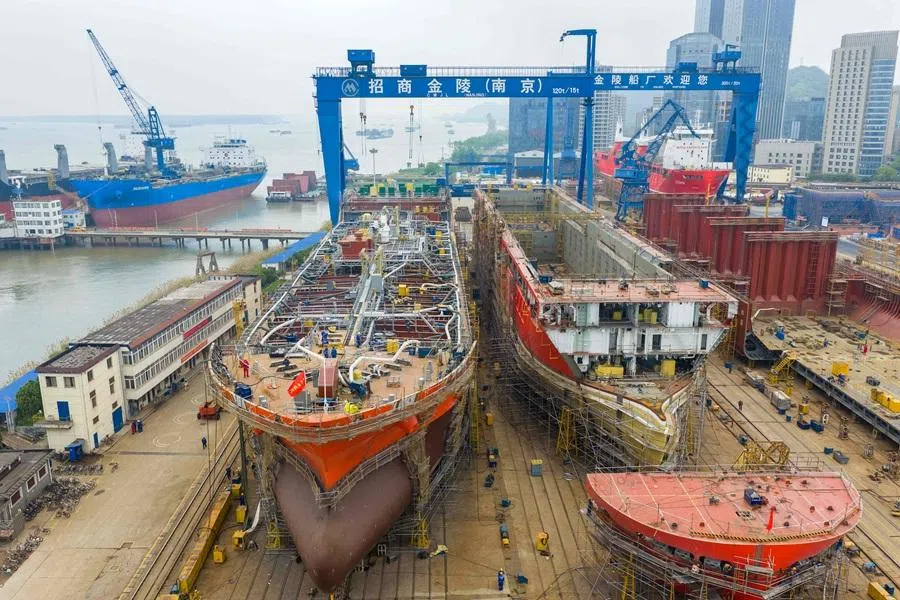 Workers build large vessels at the Jinling Shipyard, operated by China Merchants Industry in Nanjing, in China's eastern Jiangsu province, on 16 April 2026. (CN-STR/AFP)
