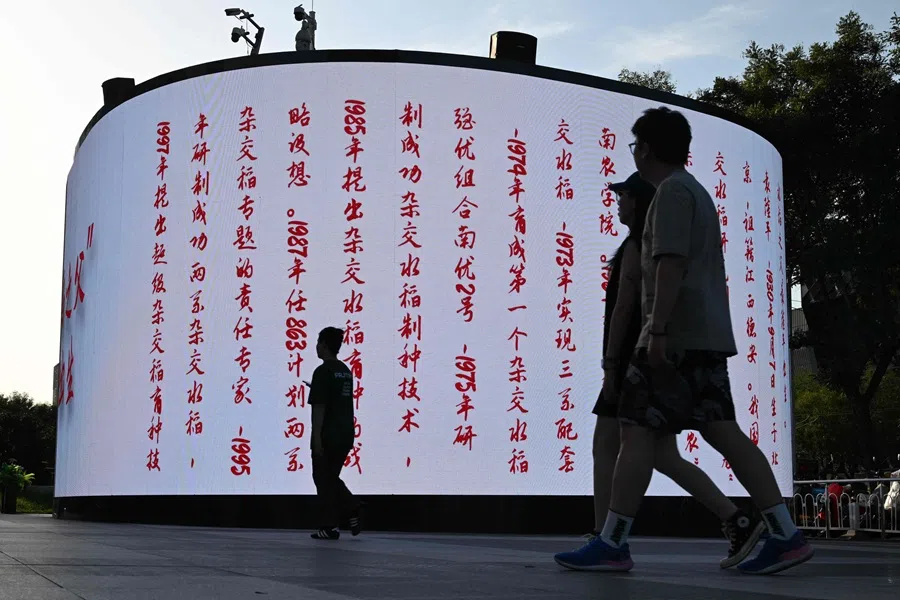 People visit a shopping mall in Beijing on 7 September 2025.