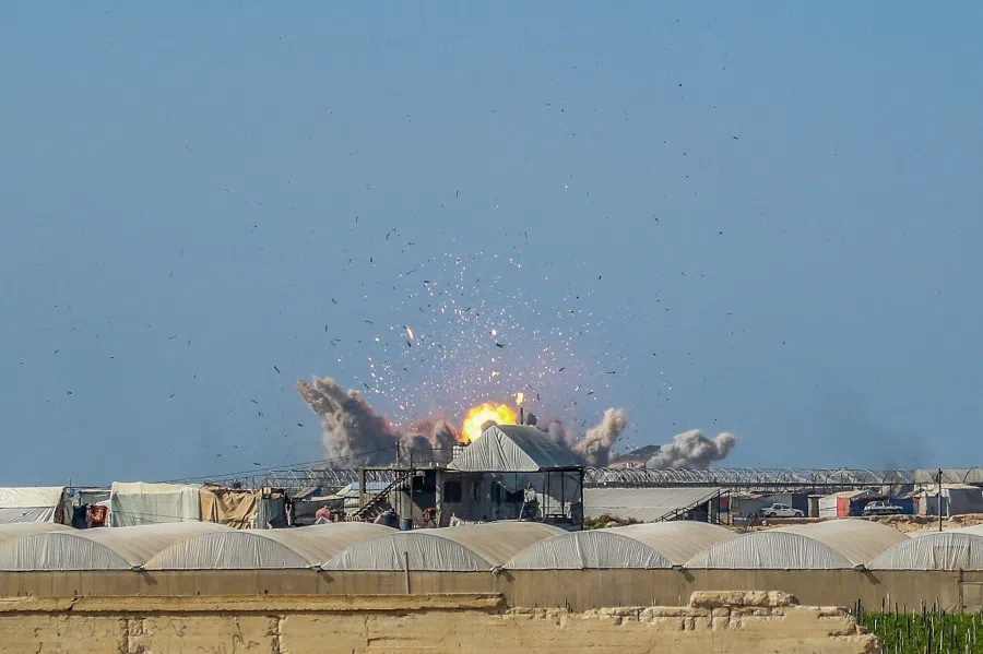 An explosion from an Israeli airstrike in Khan Yunis is pictured on 13 November 2024, amid the ongoing war between Israel and Hamas.  (Bashar Taleb/AFP)
