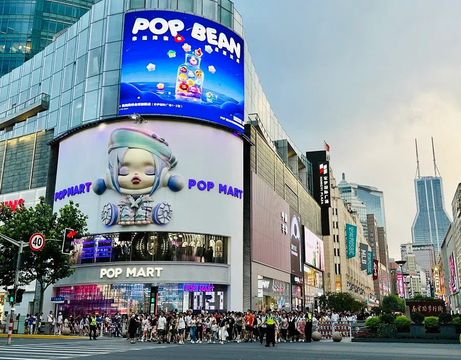 The trendy blind box brand Pop Mart has replaced the Korean cosmetics brand Innisfree to become the “face” of the intersection of Nanjing Road Pedestrian Street, Shanghai, China, 10 August 2023.