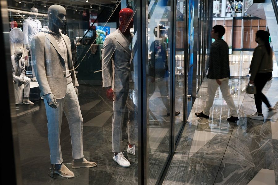 Men's suits are displayed in a window at the Hudson Yards Mall on 12 May 2022 in New York City, US. (Spencer Platt/Getty Images/AFP)