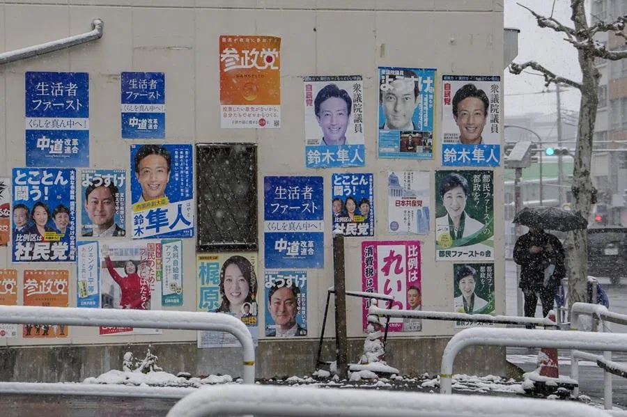 A man walks past election posters of candidates in Tokyo, Japan, on 8 February 2026. (Toru Hanai/Bloomberg)