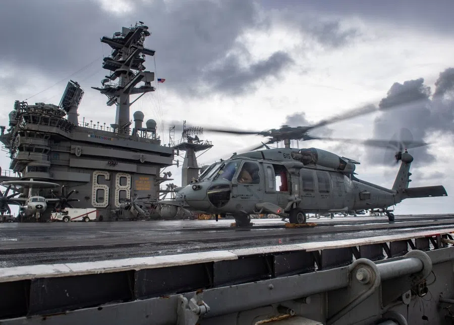 An MH-60S Sea Hawk helicopter conducts flight control checks on the flight deck of the US Navy aircraft carrier USS Nimitz in the Indian Ocean, 25 November 2020. (U.S. Navy/Mass Communication Specialist 3rd Class Elliot Schaudt/Handout via REUTERS)