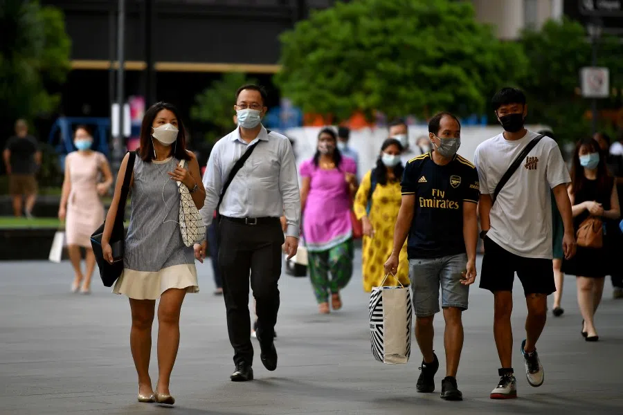 People walking at Raffles Place within the heart of Singapore's financial centre in the CBD area, 11 May 2021. (SPH)