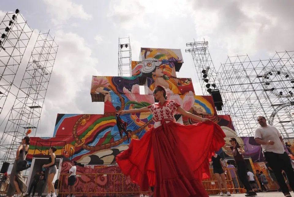 A performer practicing for the Chingay Parade 2023, a multicultural event involving the Chinese other ethnic groups in Singapore, in December 2022. (SPH Media)