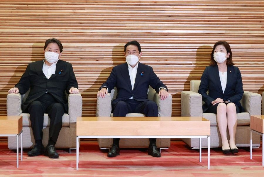 Japan's Prime Minister Fumio Kishida (centre) and his Cabinet members attend a meeting at the prime minister's office in Tokyo on 22 July 2022. (Jiji Press/AFP)