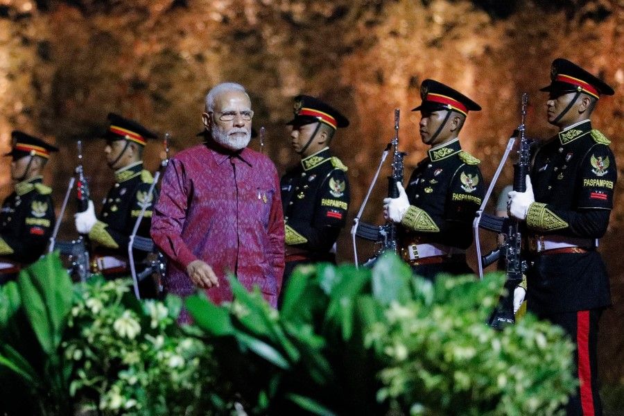 India's Prime Minister Narendra Modi walks at the welcoming dinner during the G20 Summit in Badung on the Indonesian resort island of Bali on 15 November 2022. (Willy Kurniawan/AFP)