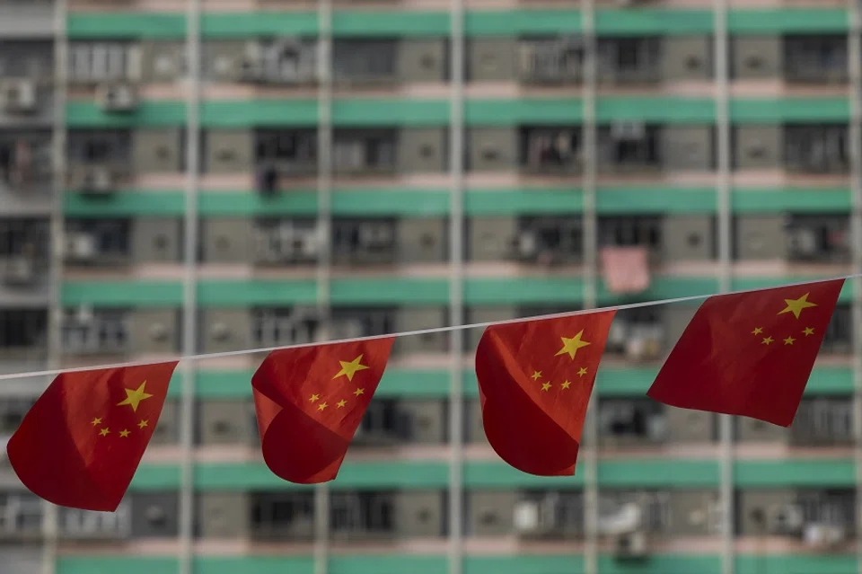 Chinese national flags displayed at Wong Tai Sin Temple to mark National Day in Hong Kong, China, on 1 October 2021. (Paul Yeung/Bloomberg)