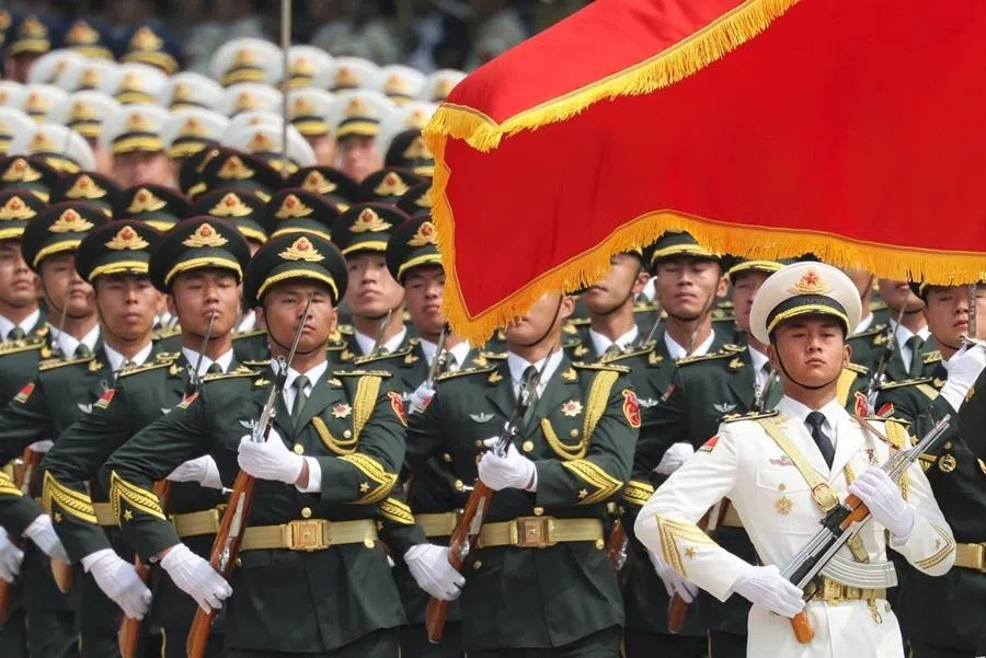Chinese People's Liberation Army (PLA) honour guards march at the Great Hall of the People in Beijing, China, on 14 May 2026.