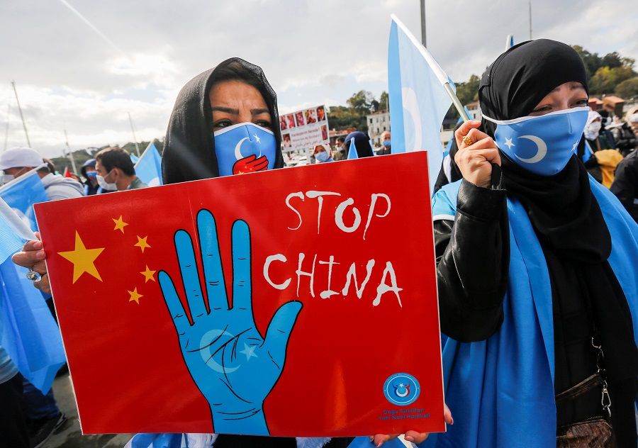 Ethnic Uighur demonstrators take part in a protest against China, in Istanbul, Turkey, 1 October 2021. (Dilara Senkaya/Reuters)