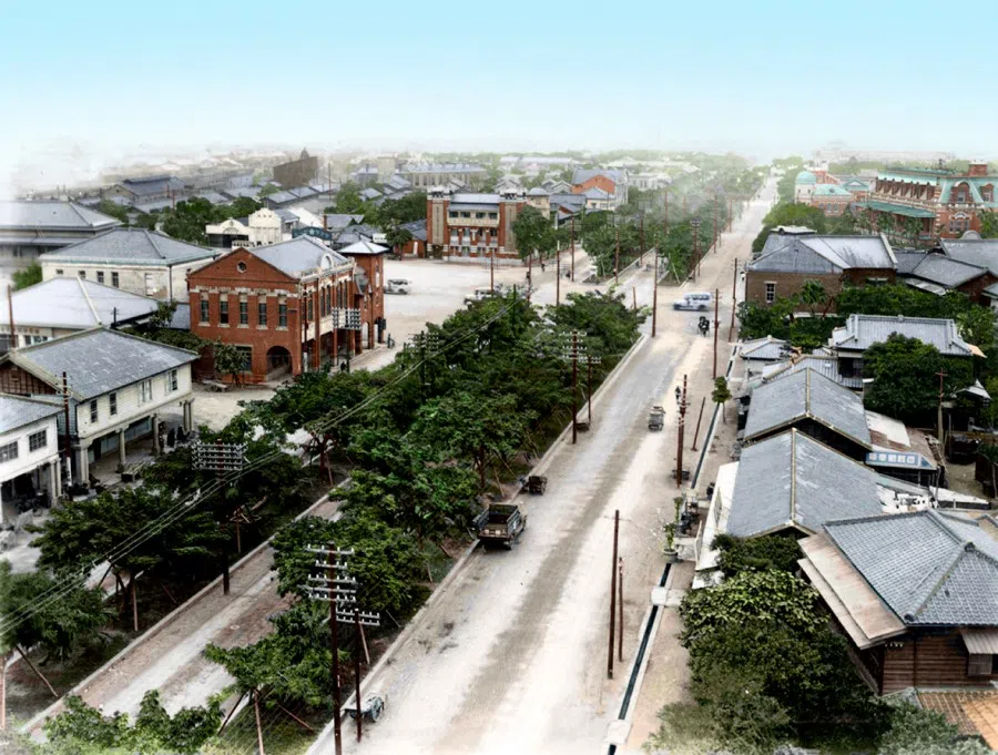 A street near the Taipei train station, 1930s. The Japanese colonial authorities demolished Chinese buildings in the cities of Taiwan and forcibly rebuilt the cities in Japanese style.