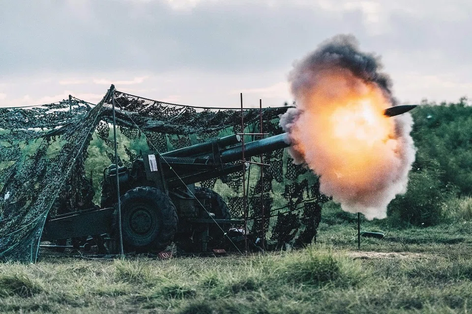 This Taiwan's Ministry of National Defense handout picture taken and released on 24 August 2022 shows a US-made 155mm howitzer firing during a drill at Penghu islands. (Handout/Taiwan's Ministry of National Defense/AFP)