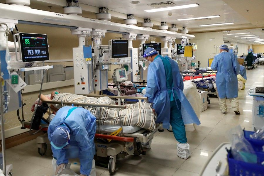 Medical workers attend to patients at the intensive care unit of the emergency department at Beijing Chaoyang hospital, amid the Covid-19 outbreak in Beijing, China, 27 December 2022. (China Daily via Reuters)