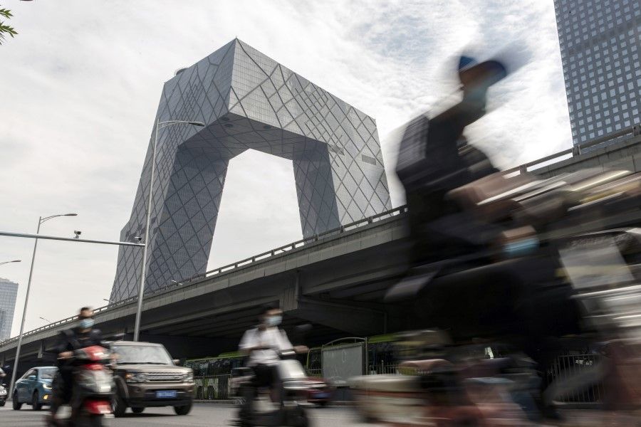 Motorists travel past China Central Television (CCTV) headquarter building in the central business district in Beijing, China, on 27 May 2021. (Qilai Shen/Bloomberg)