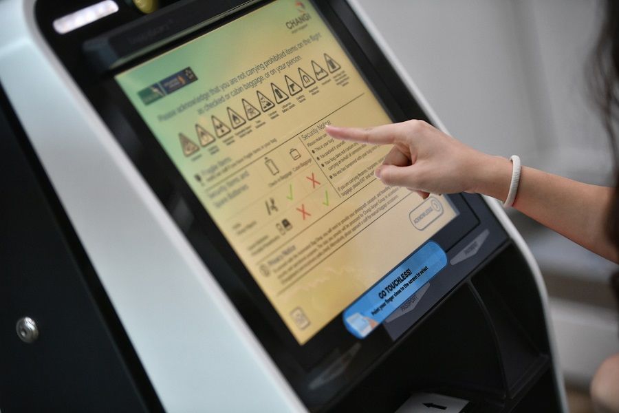 An automated kiosk fitted with proximity touch screens with infrared sensors to track finger movements is seen at the Singapore Changi Airport. (SPH)