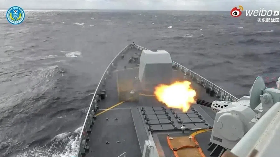 This frame grab from China’s People’s Liberation Army (PLA) Eastern Theater Command undated handout video footage released on 29 December 2025 via AFPTV shows a Chinese warship shooting in an undisclosed location.