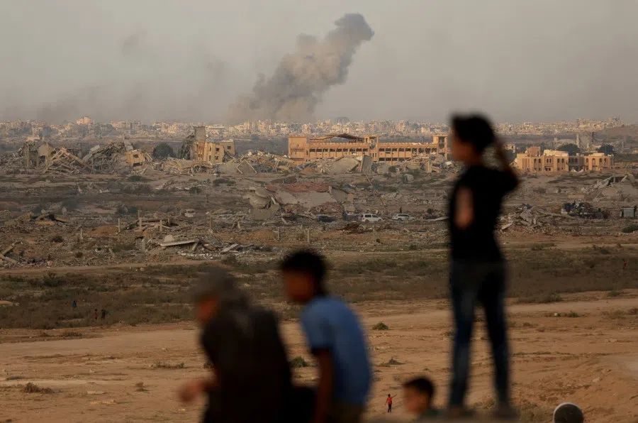 Smoke rises following an Israeli strike amid an Israeli operation, as seen from central Gaza Strip, on 21 September 2025. (Dawoud Abu Alkas/Reuters)