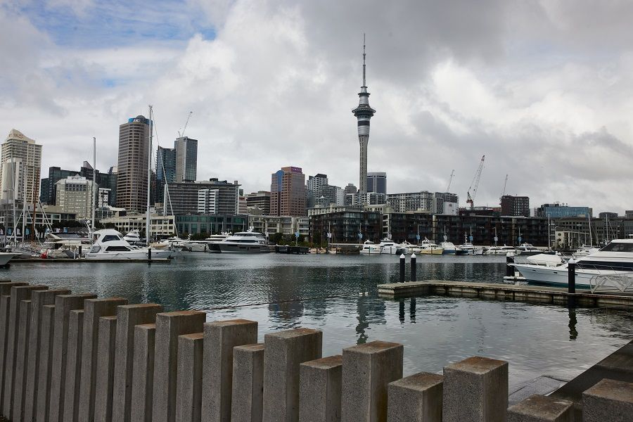 The Sky Tower is seen beyond yachts moored in a marina in Auckland, New Zealand, on 16 September 2021. (Brendon O'Hagan/Bloomberg)