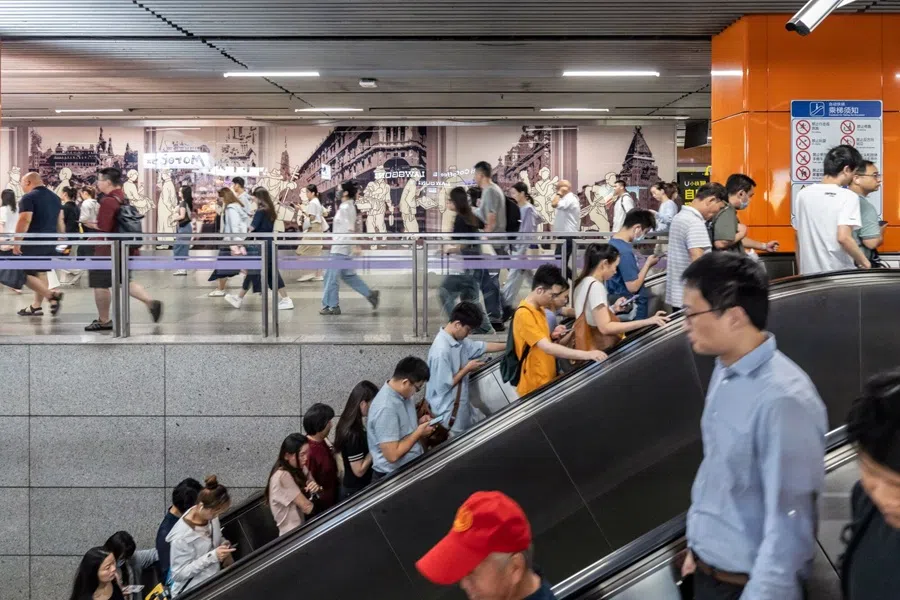 Passengers on escalators at a subway station in Shanghai, China, 10 September 2025. (Qilai Shen/Bloomberg)