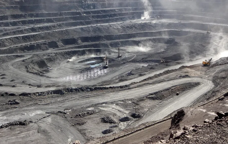 Miners are seen at the Bayan Obo mine containing rare earth minerals, in Inner Mongolia, China, 16 July 2011. (Stringer/Reuters)