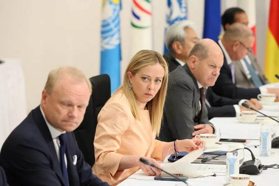 Italy's Prime Minister Giorgia Meloni (second from left) and Germany's Chancellor Olaf Scholz (right) taking part in the "Partnership for Global Infrastructure and Investment" meeting during the second day of the G7 Summit Leaders' Meeting in Hiroshima on 20 May 2023. (Handout/Ministry of Foreign Affairs of Japan/AFP)