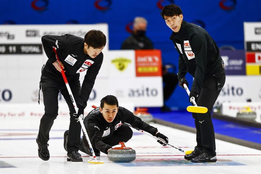 The Japanese men's curling team competes against South Korea during the curling qualifying tournament for the 2022 Beijing Winter Olympics at the Eleven Cities Hall in Leeuwarden, on 13 December 2021. (Vincent Jannink/AFP)