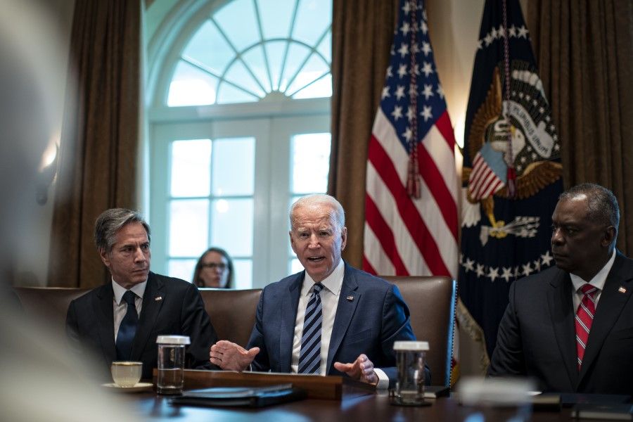US President Joe Biden speaks as Antony Blinken, US secretary of state (left), and Lloyd Austin, US secretary of defense (right), listen during a cabinet meeting at the White House in Washington DC, US, on 20 July 2021. (Al Drago/Bloomberg)