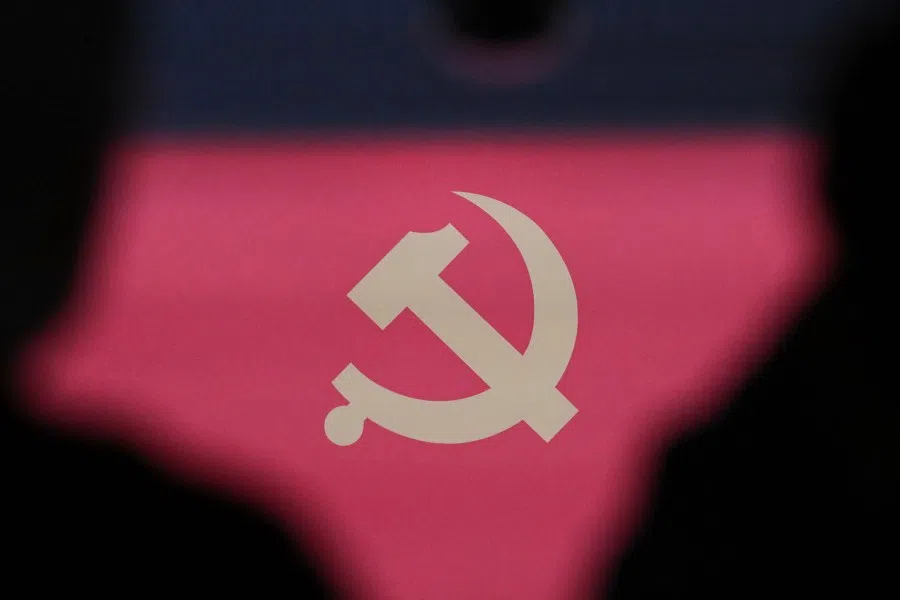 The communist emblem is seen during a press conference of the Central Committee of the Chinese Communist Party in Beijing on 24 October 2025. (Pedro Pardo/AFP)