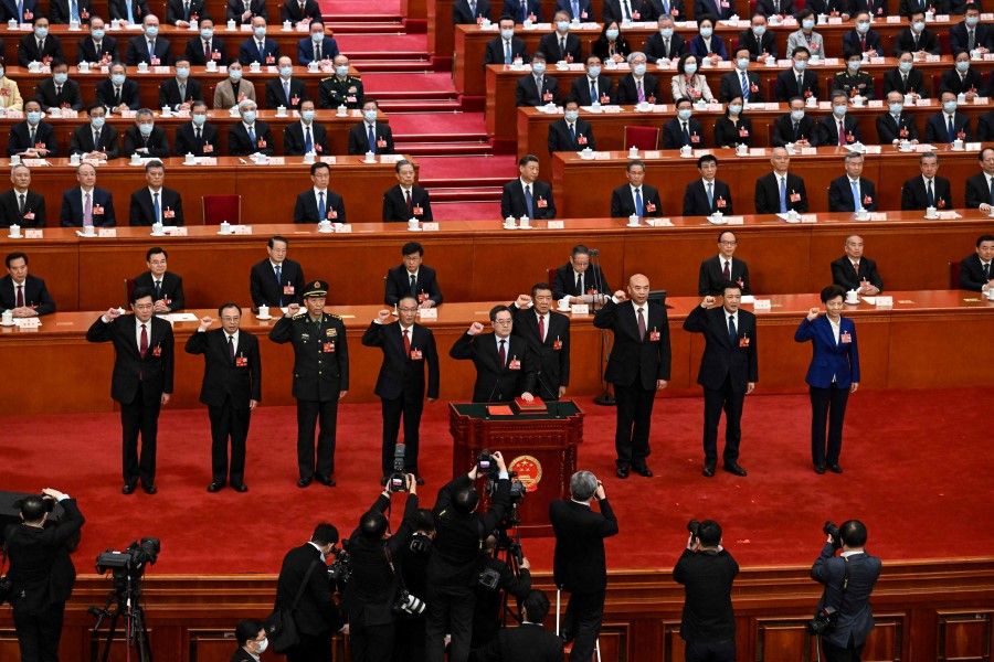 The fifth plenary session of the National People's Congress (NPC) at the Great Hall of the People in Beijing on 12 March 2023. China's former foreign minister Qin Gang (standing, first from left) was removed from office on 25 July 2023. (Noel Celis/AFP)