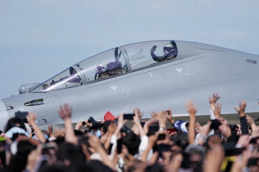 A J-16 pilot waves to visitors at the Changchun Airshow, on 20 September 2025.