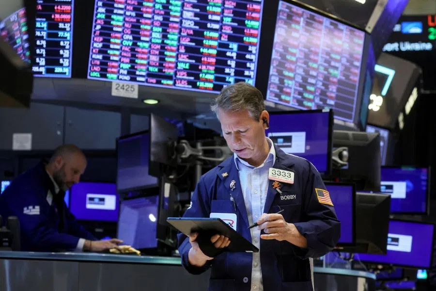 Traders work on the floor of the New York Stock Exchange in New York City, US, 10 March 2022. (Brendan McDermid/Reuters)